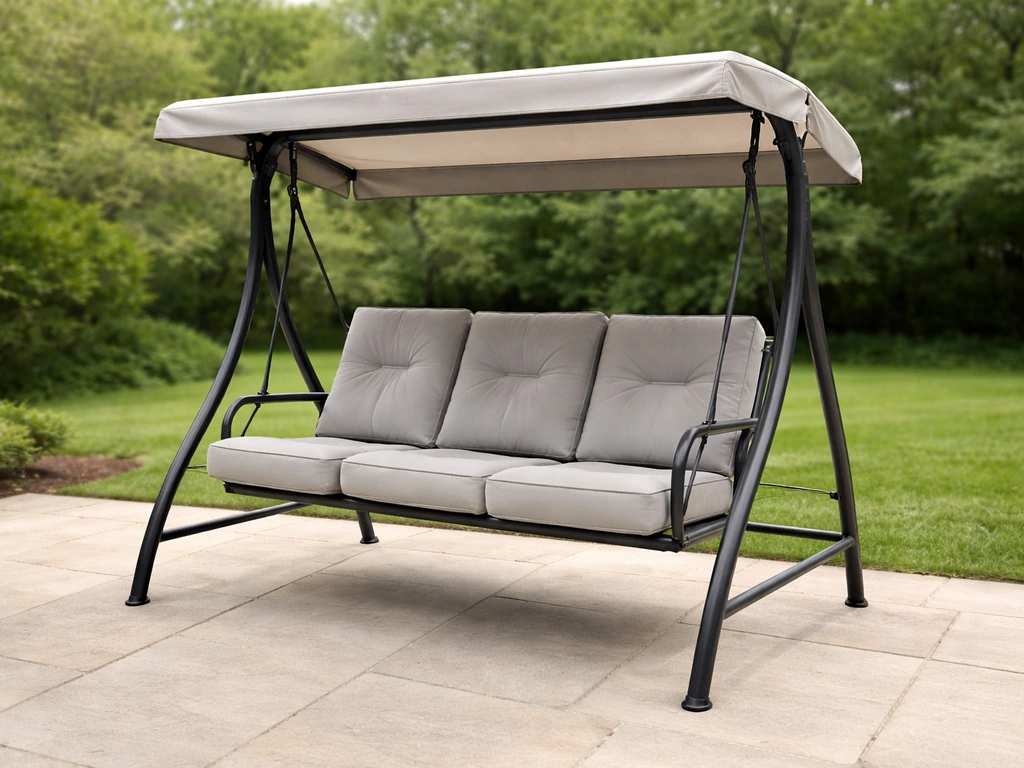 Outdoor Expressions-style 3-person powder-coated steel swing with tilt canopy on a patio