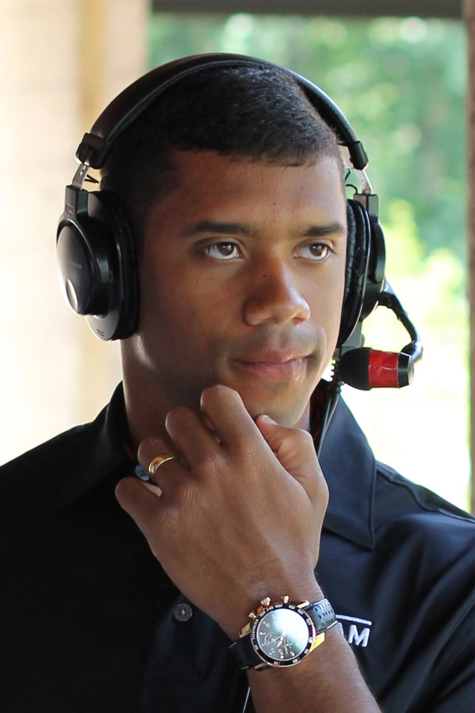 Russell Wilson wearing a headset, portrait photo