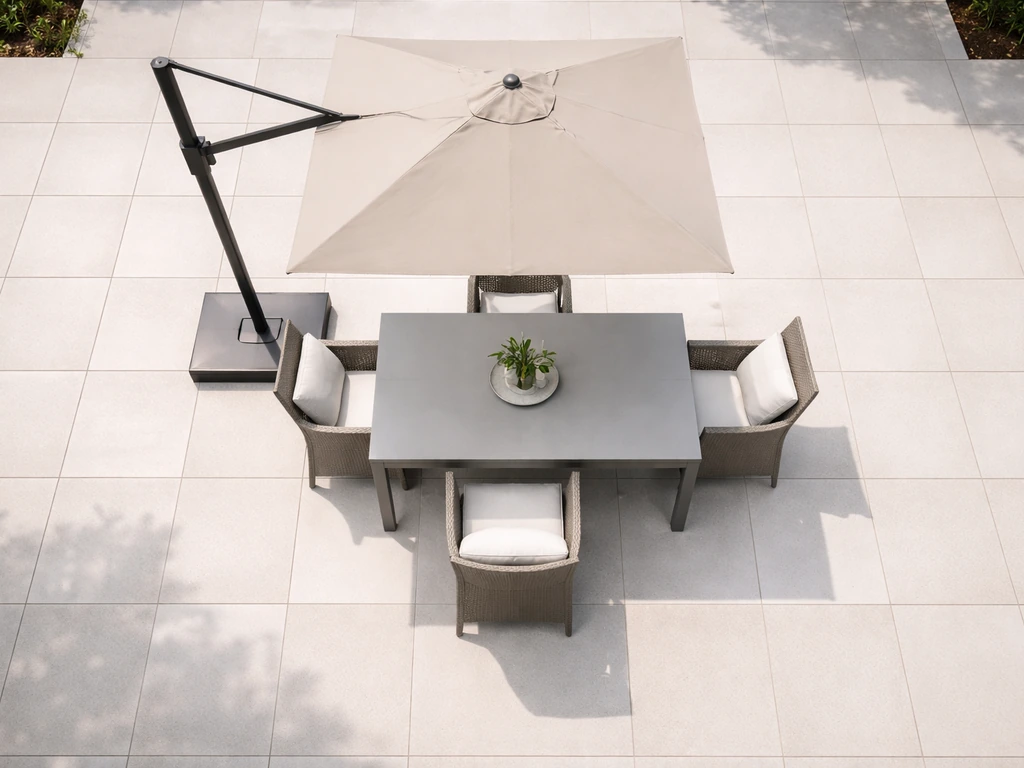 Overhead view of a backyard dining setup under a cantilever umbrella with a clear 2-foot spacing rule.