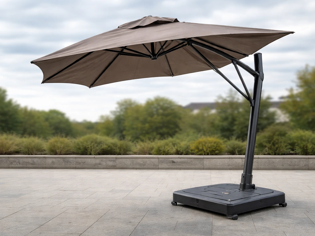 Large patio umbrella in a windy outdoor setting, showing an open vented canopy and stable heavy base.