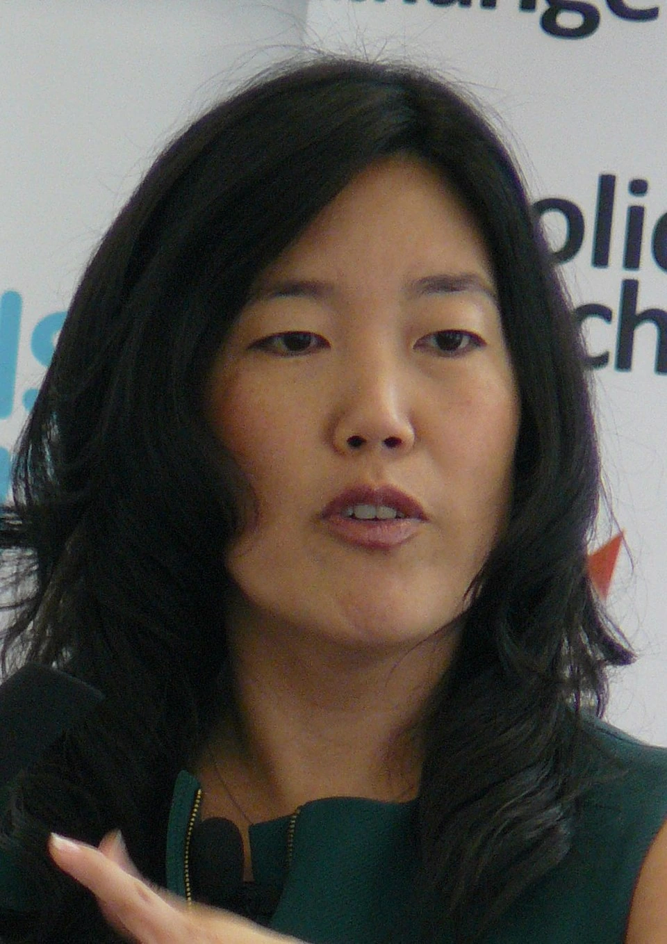 Michelle Rhee speaking at an event, close-up portrait photo.