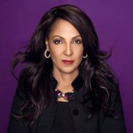 Portrait of Michelle Bernard against a purple background