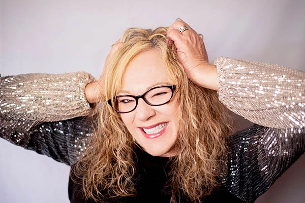 Michelle Rider, known as Shelly Belly, smiling in a portrait photo