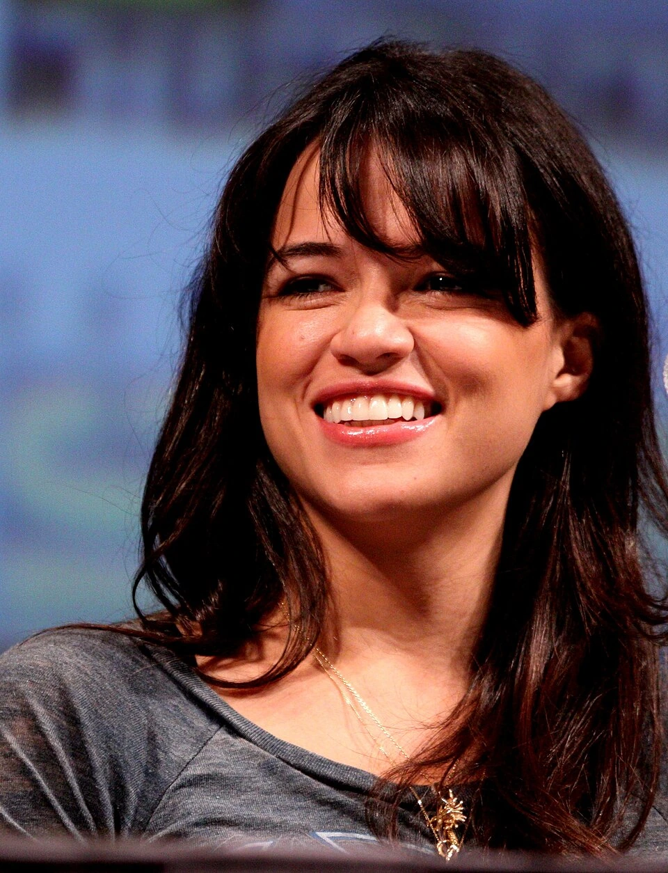 Michelle Rodriguez smiling in a portrait photo