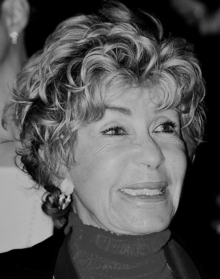 Black-and-white portrait photo of Micheline Roquebrune smiling.