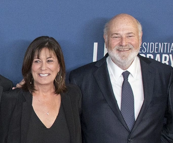 Michele Singer Reiner posing with Rob Reiner at an event