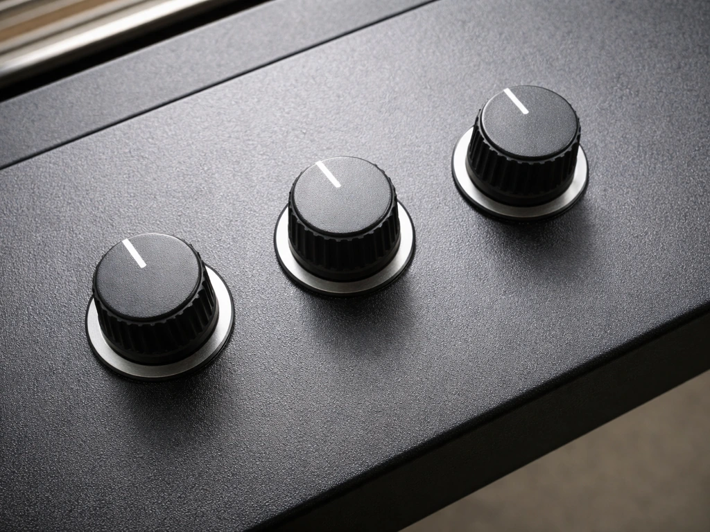 Top-down close-up of three dimmer switches on a grow light fixture, with band intensity controls visible.