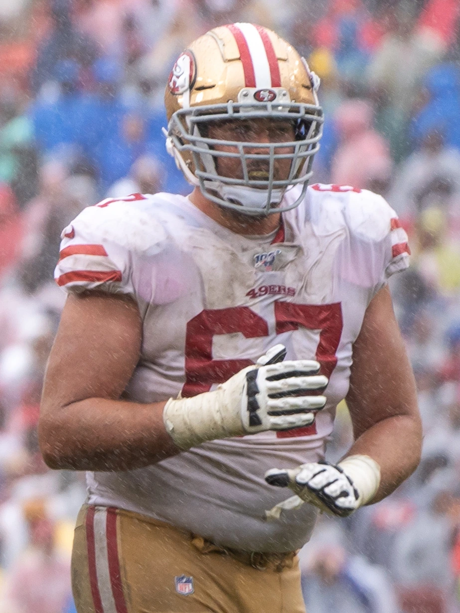 Justin Skule in a San Francisco 49ers uniform during a game, wearing helmet and jersey number 67.