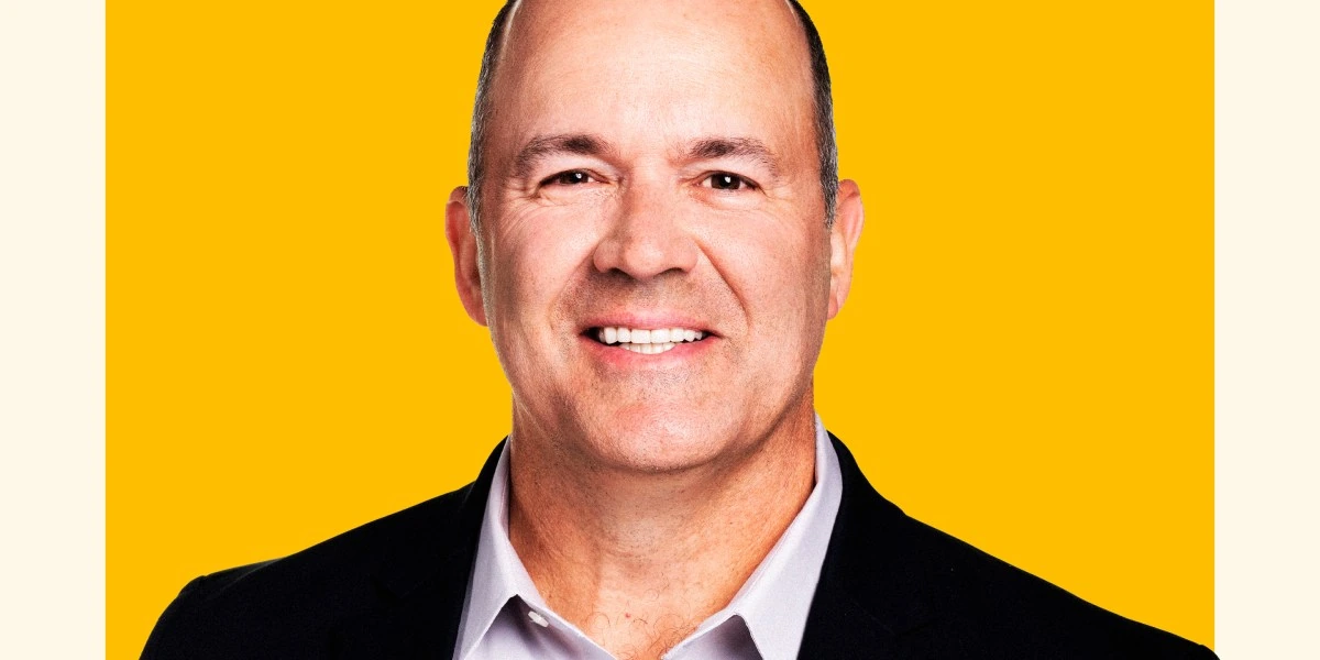 Portrait of Matt Schroeder against a yellow background.