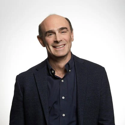 Ted Schlein, Silicon Valley venture capitalist, smiling in a studio portrait against a white background.