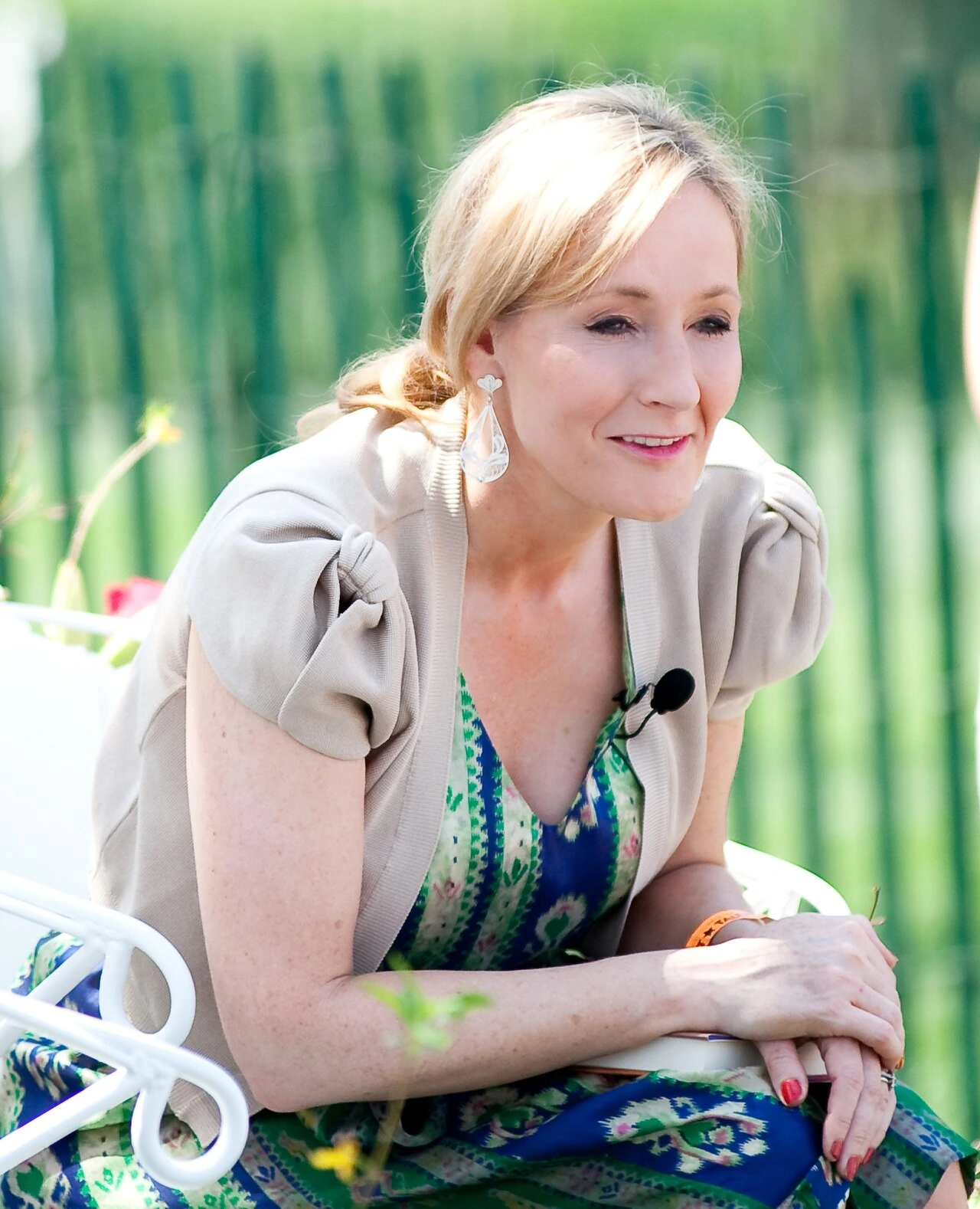 J.K. Rowling seated outdoors in a candid photo
