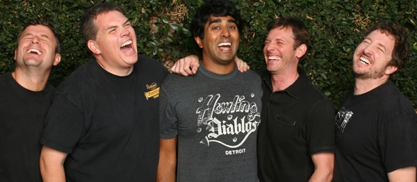 Broken Lizard comedy troupe posing together and laughing outdoors