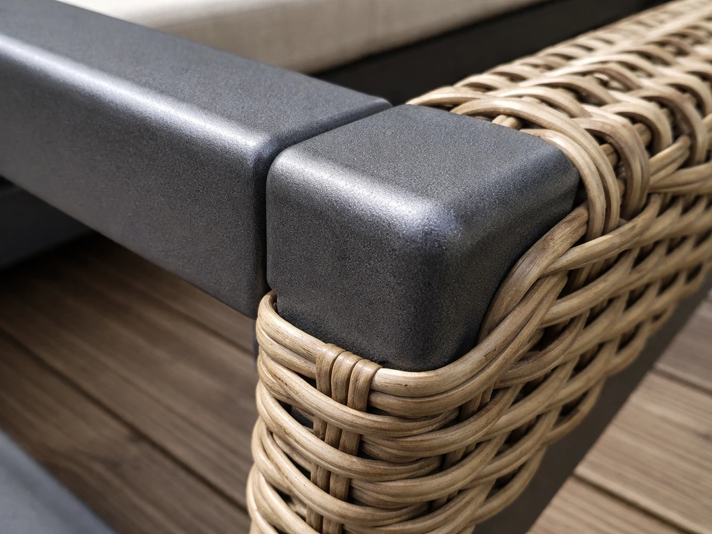 Close-up of powder-coated steel frame with PE rattan/wicker weave outdoors.