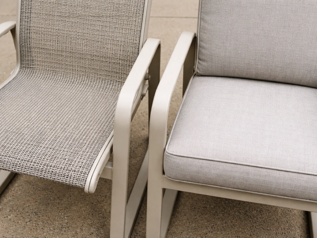 Close-up of two Telescope-style chair frames showing sling mesh drainage versus cushion seating fabric.