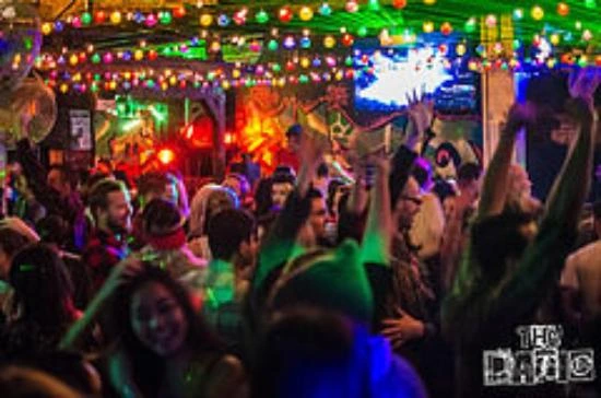 Crowded nightclub dance floor with colorful lights at The Patio Orlando