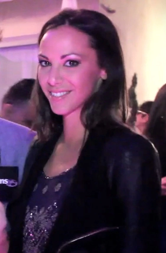 Kristen Doute at an event, smiling in a candid photo