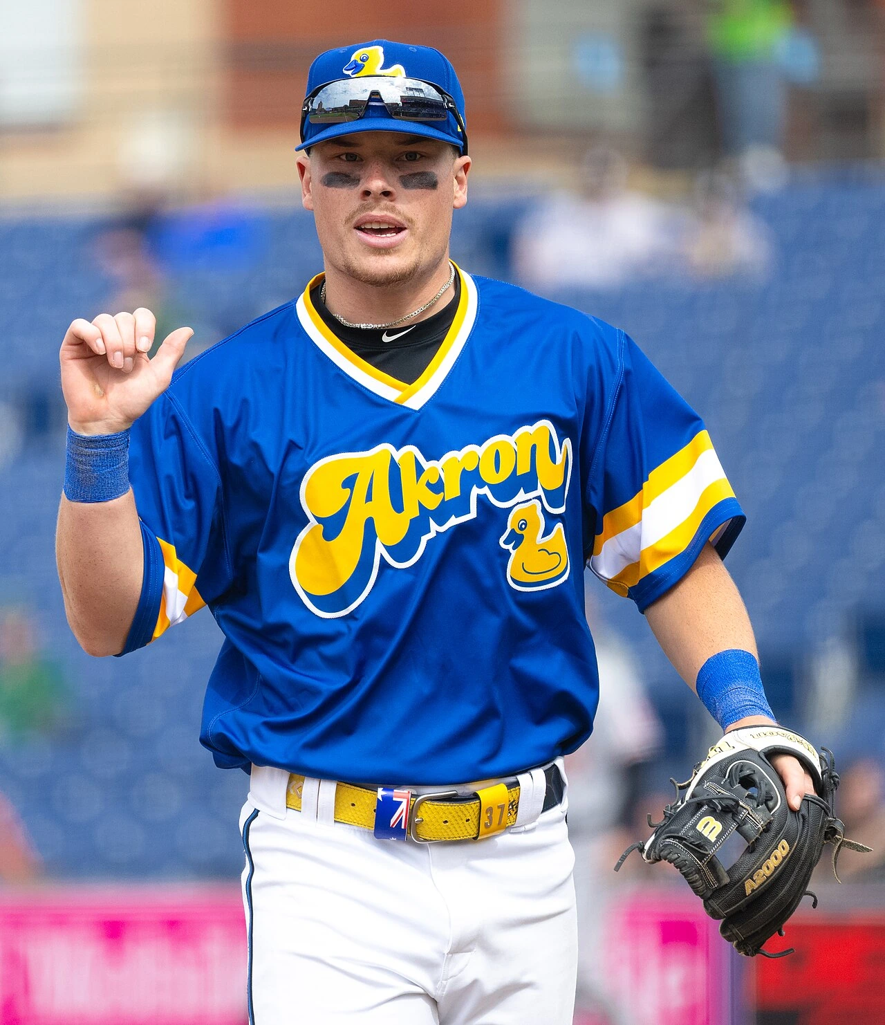 Travis Bazzana in a blue Akron baseball uniform on the field