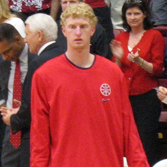 Chase Budinger in a red warmup shirt standing on the court during a basketball game
