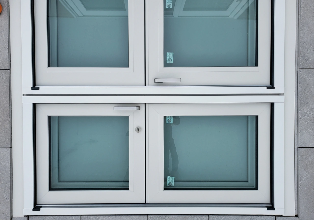 Top-down view of French-style patio doors with active leaf closed and passive leaf latched top and bottom