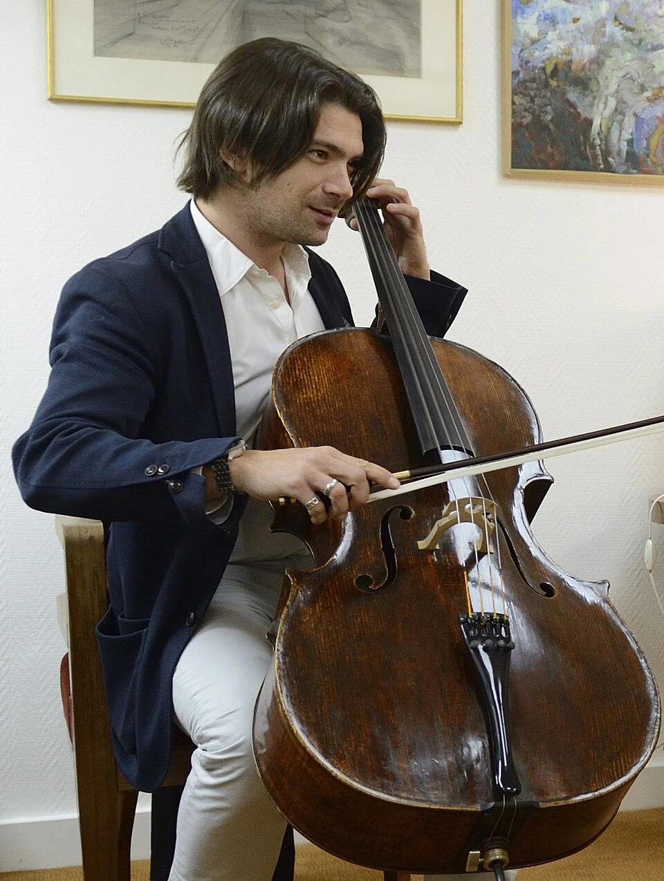 Gautier Capuçon playing the cello in a candid indoor portrait