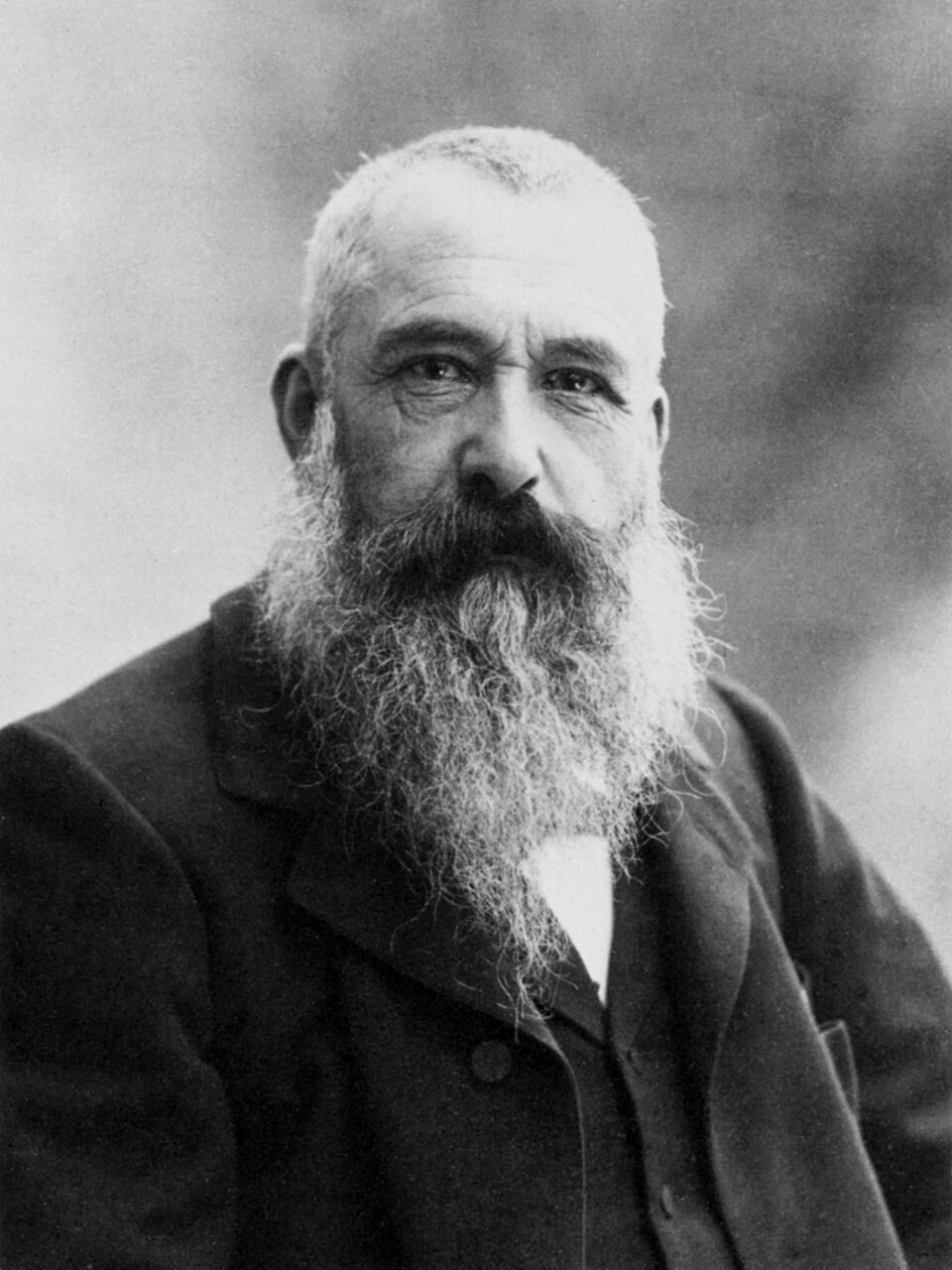 Black-and-white portrait photograph of Claude Monet