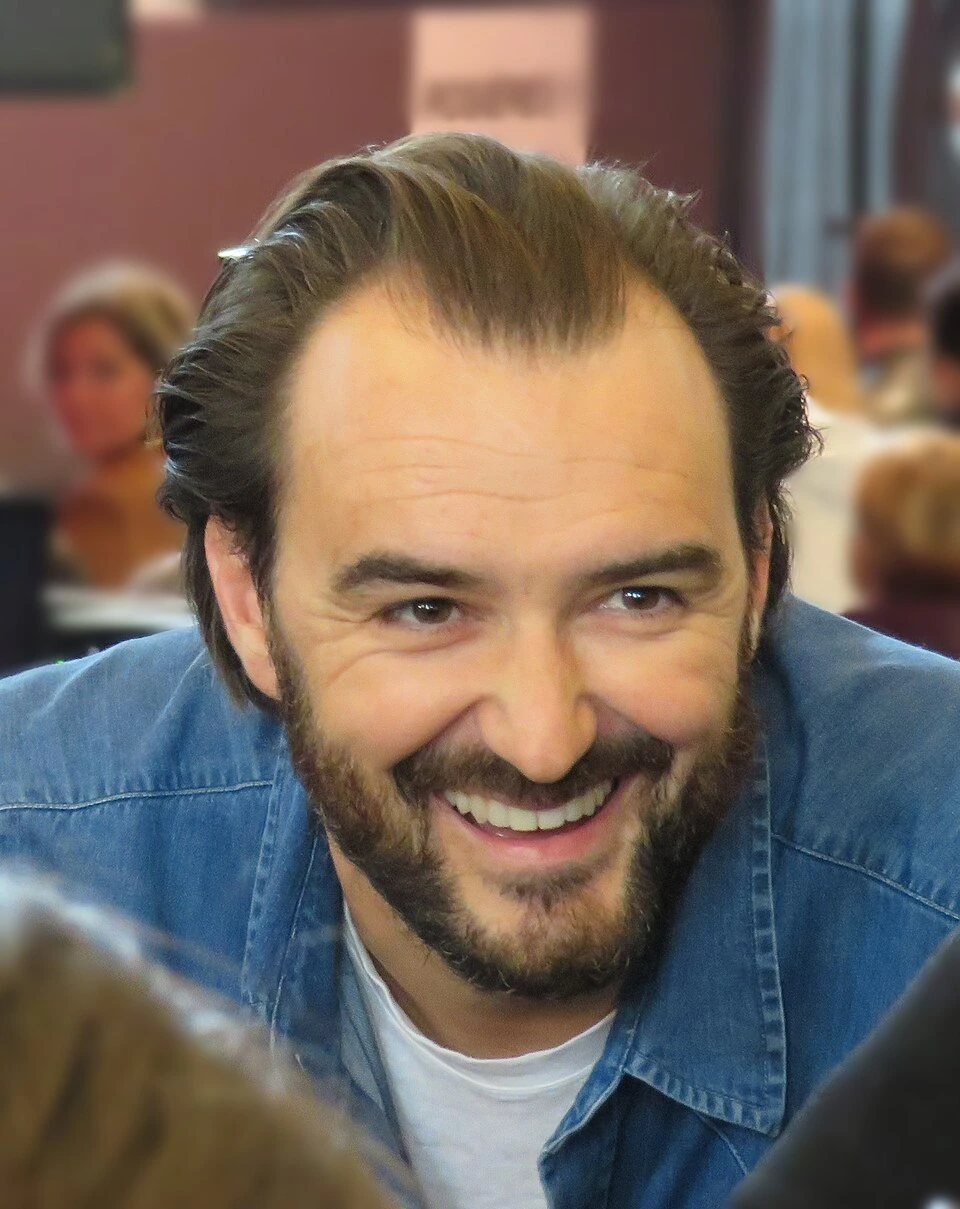 Cyril Lignac smiling at an event