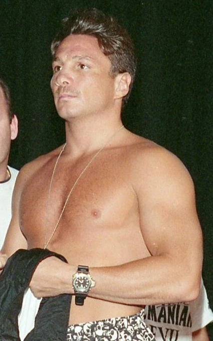 Vinny Pazienza shirtless at an event, photographed in a candid editorial-style image.
