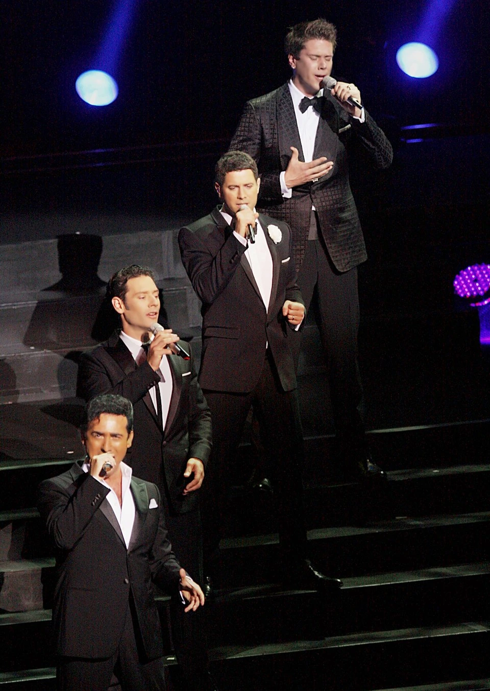 Il Divo performing on stage in formalwear