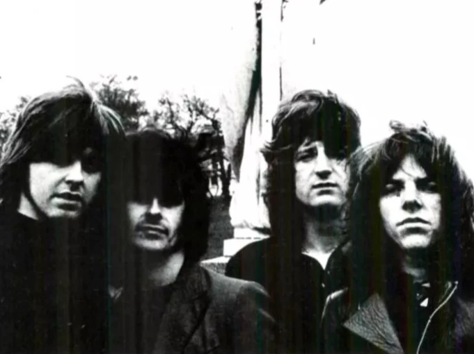 Black-and-white photo of the English rock band Badfinger standing together outdoors.