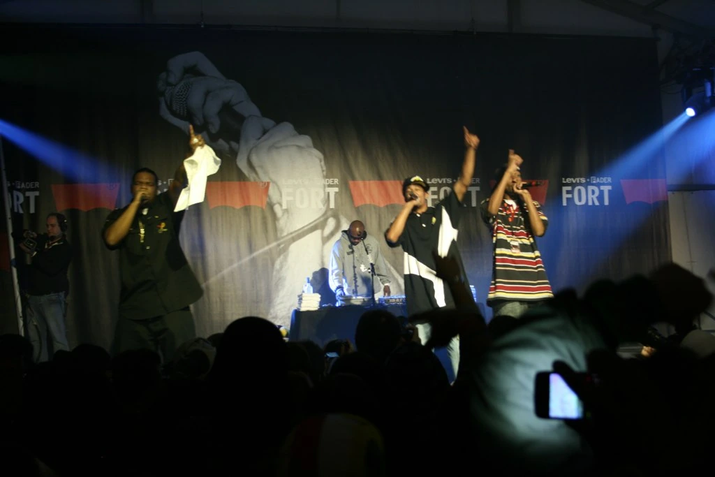 Bone Thugs-n-Harmony performing on stage at a concert