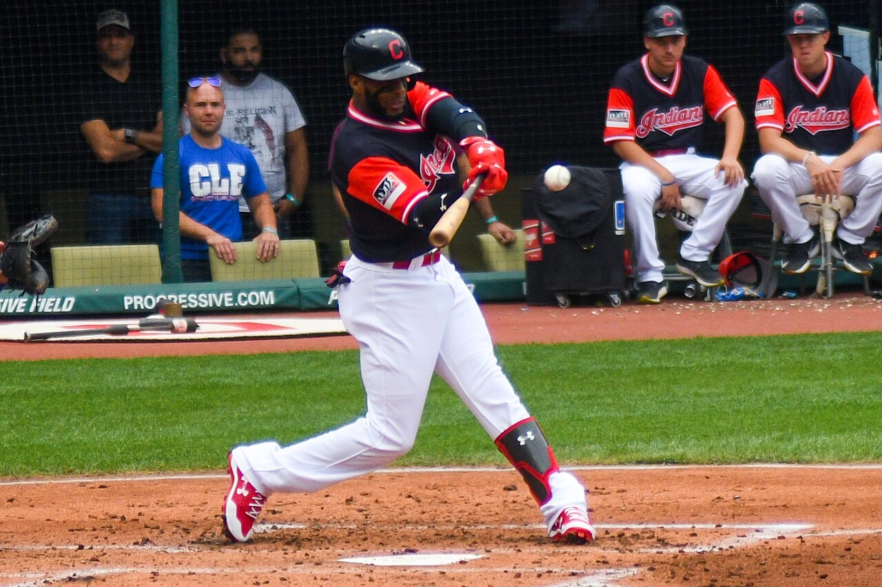 Yandy Díaz batting during a baseball game in a Cleveland Indians uniform.