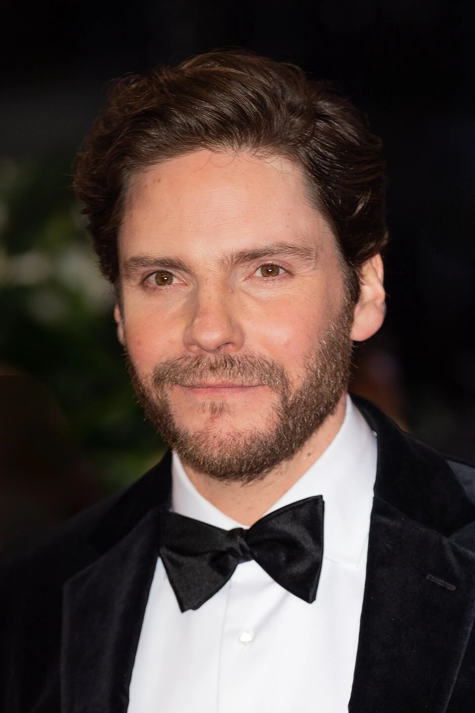 Daniel Brühl at Berlinale 2020 in a tuxedo portrait