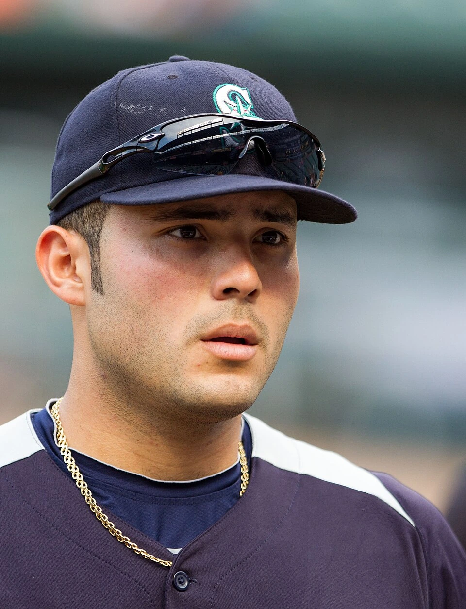 Jesús Montero in a baseball uniform and cap during a game, close-up portrait