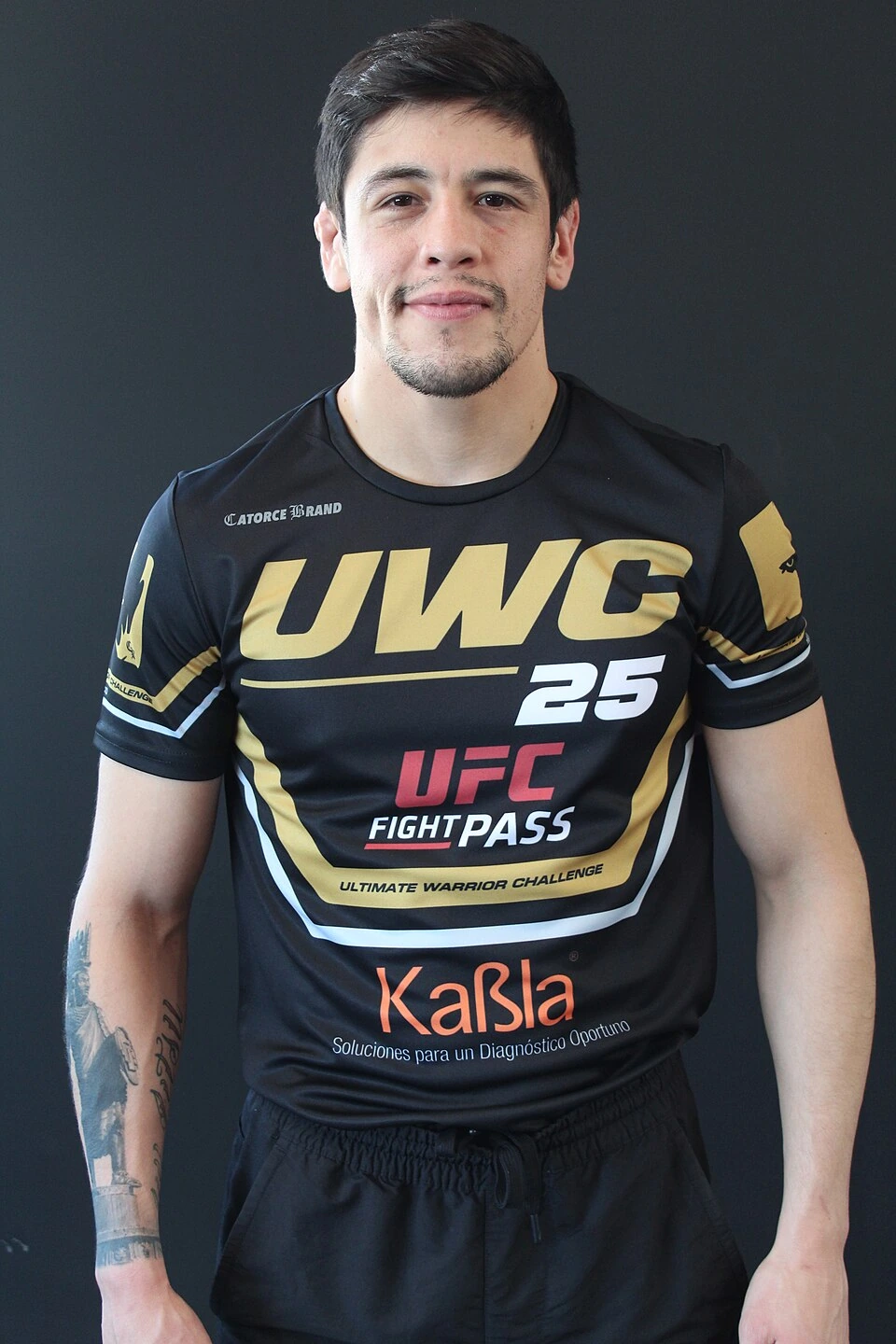 Brandon Moreno in a UFC shirt against a dark background