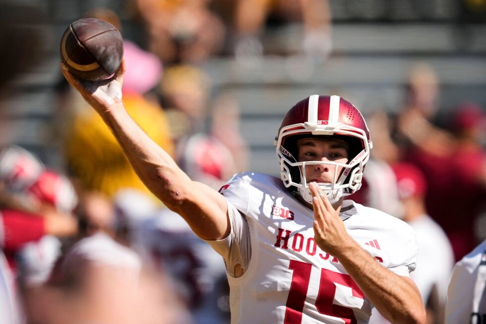 Fernando Mendoza in an Indiana Hoosiers football uniform mid-throw during practice