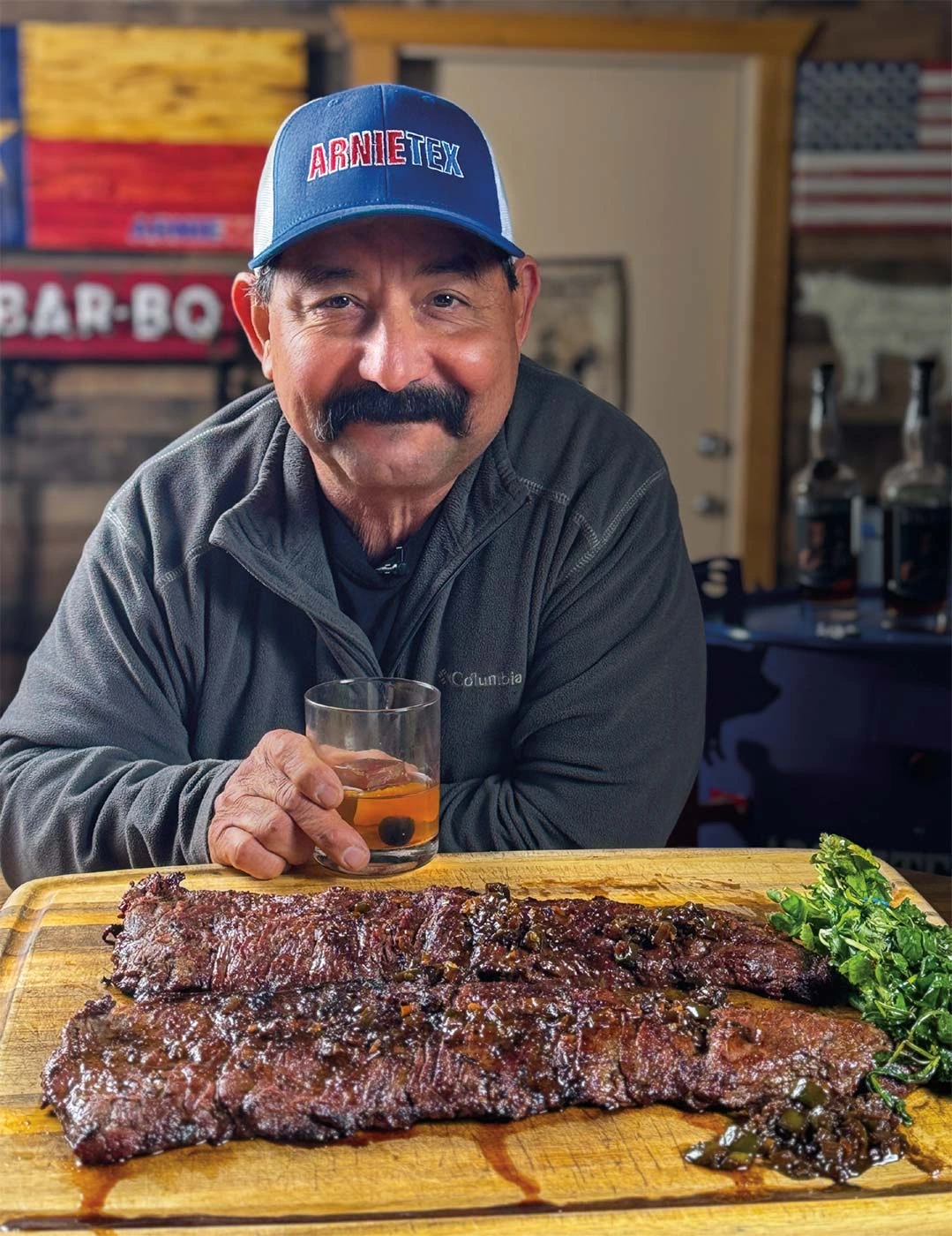 Arnulfo "Arnie" Segovia (ArnieTex) posing in a barbecue kitchen setting