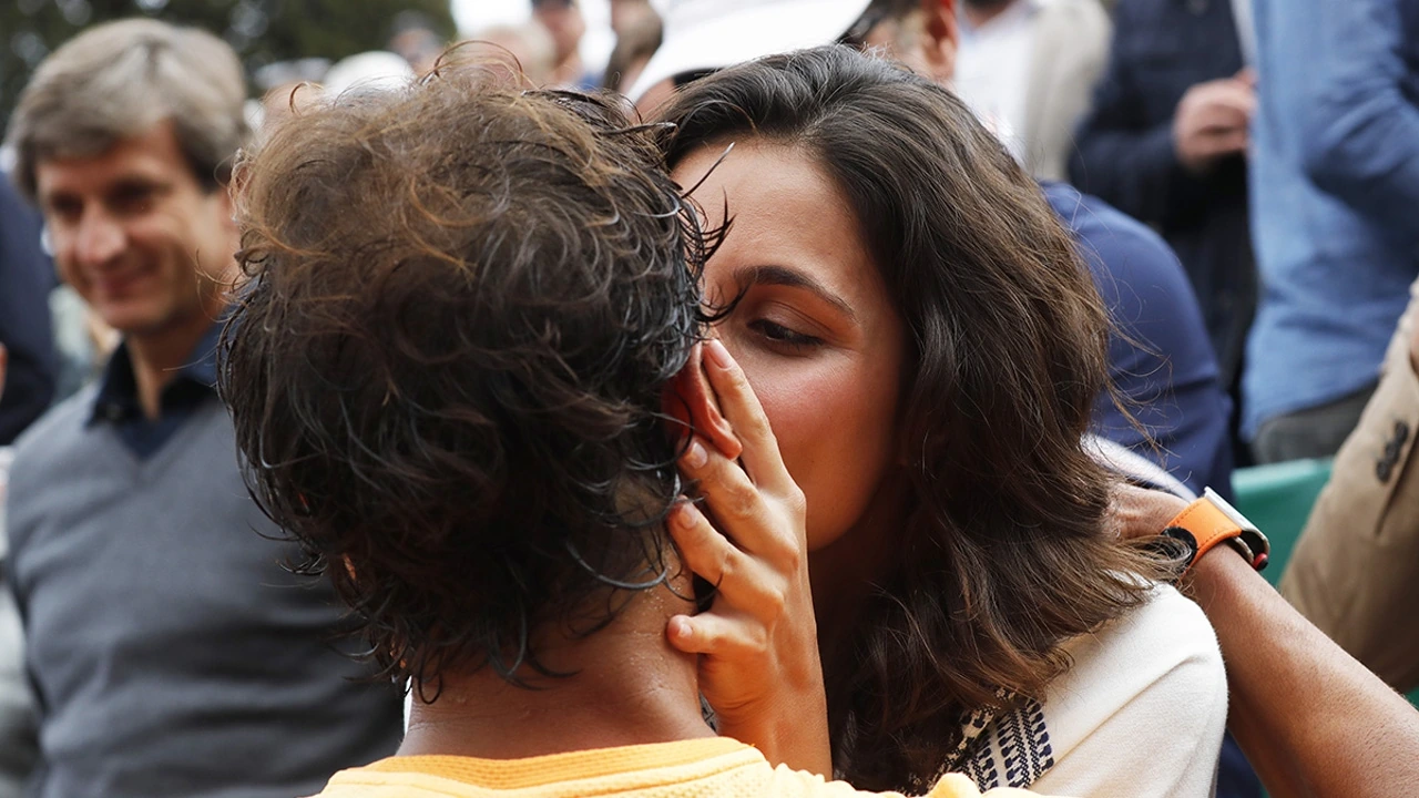 Xisca Perelló kissing Rafa Nadal in a candid public moment