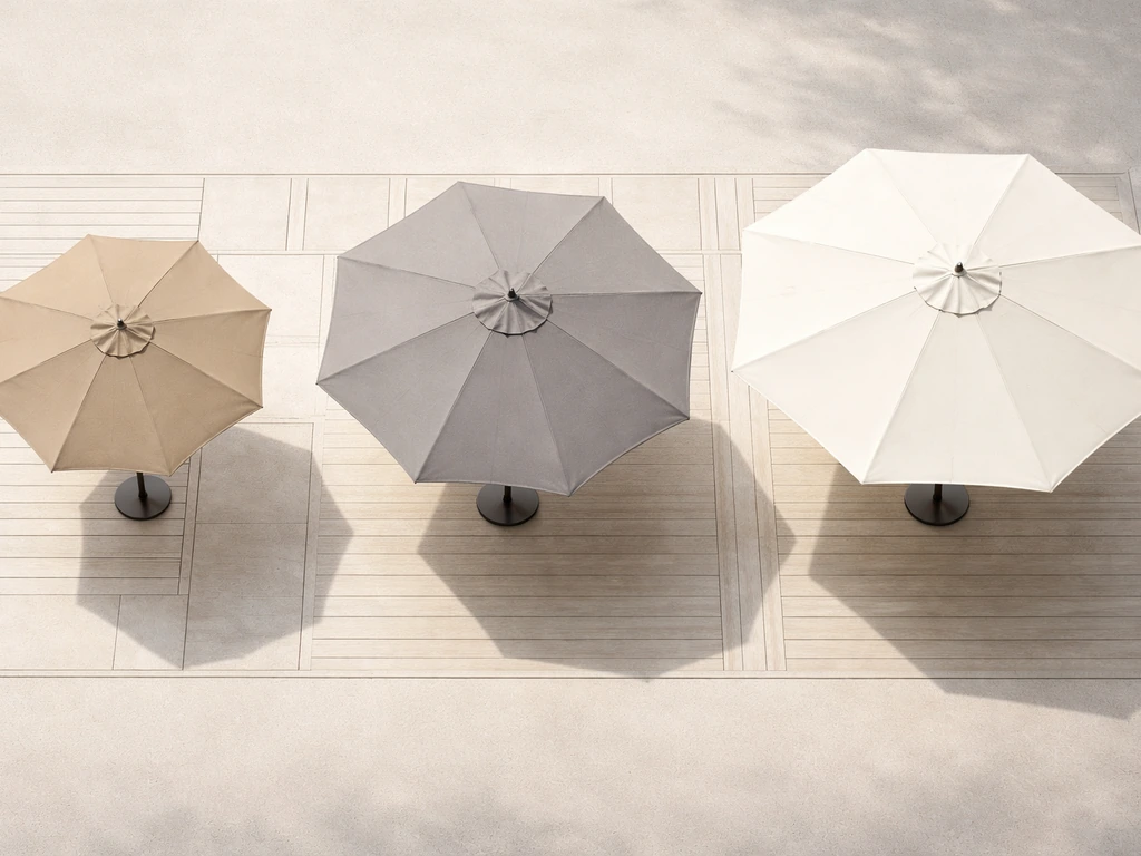 Top-down photo of patio umbrella canopies in different sizes over a simple deck plan, showing shade coverage differences