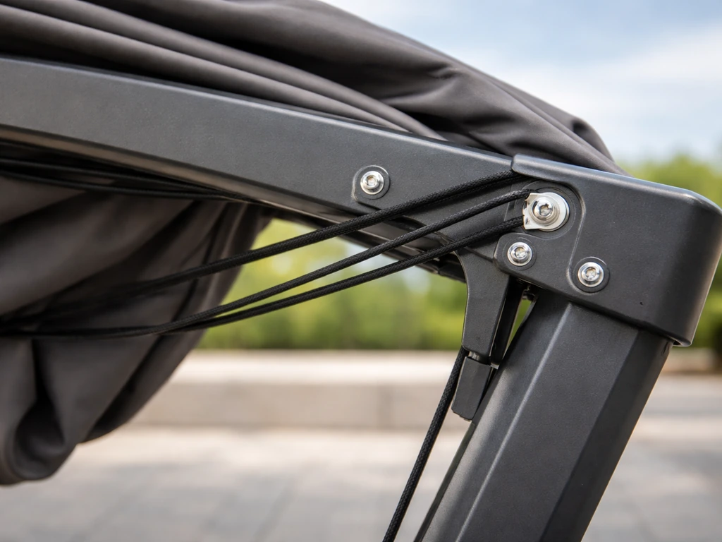 Close-up view into an offset patio umbrella cantilever arm showing the cord path and tilt hardware