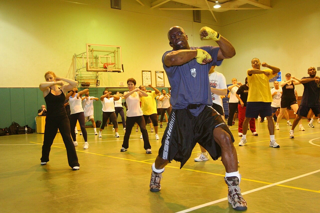 Billy Blanks leading a Tae Bo class in a gym