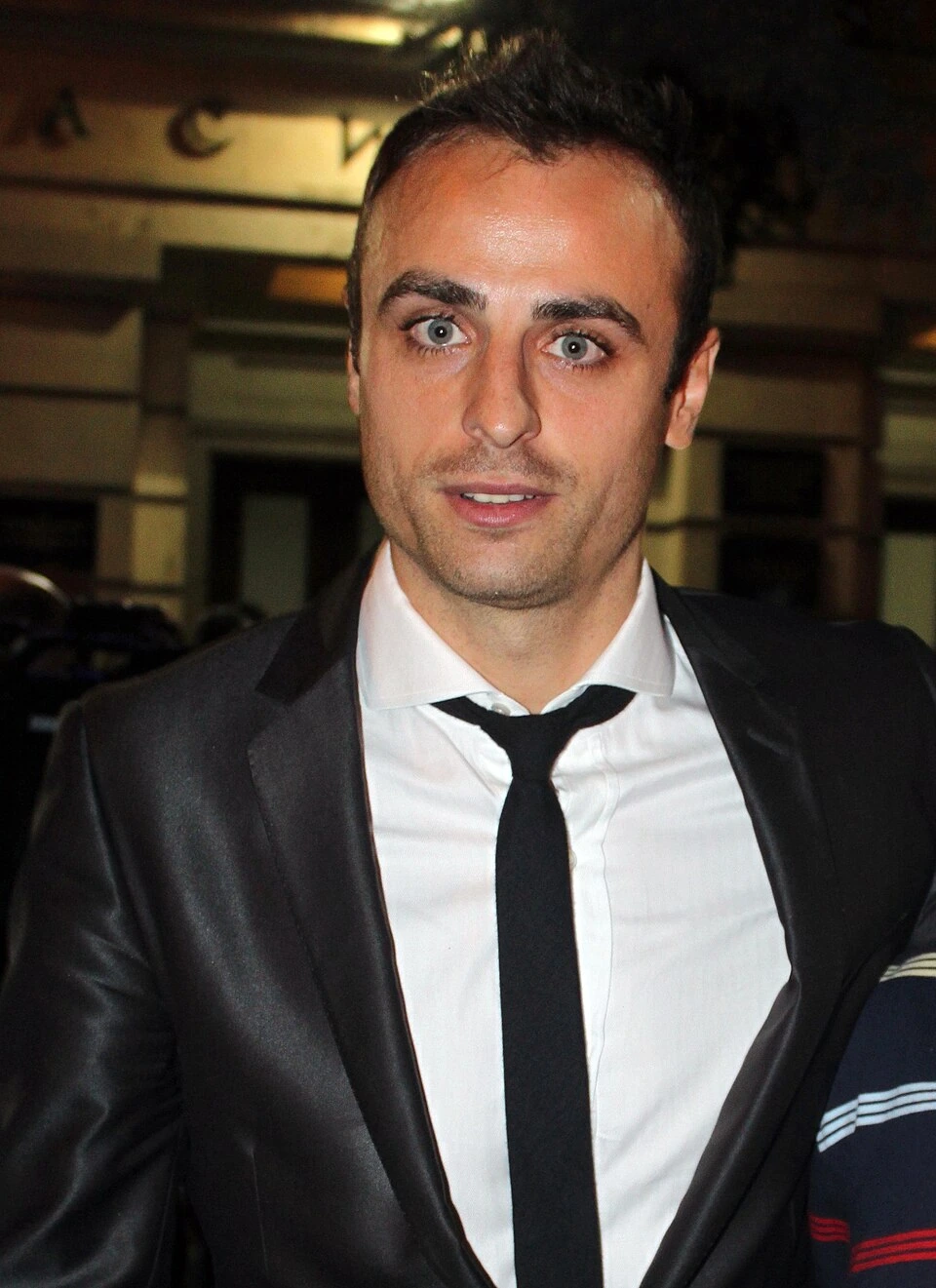Dimitar Berbatov in a formal suit, photographed at an event