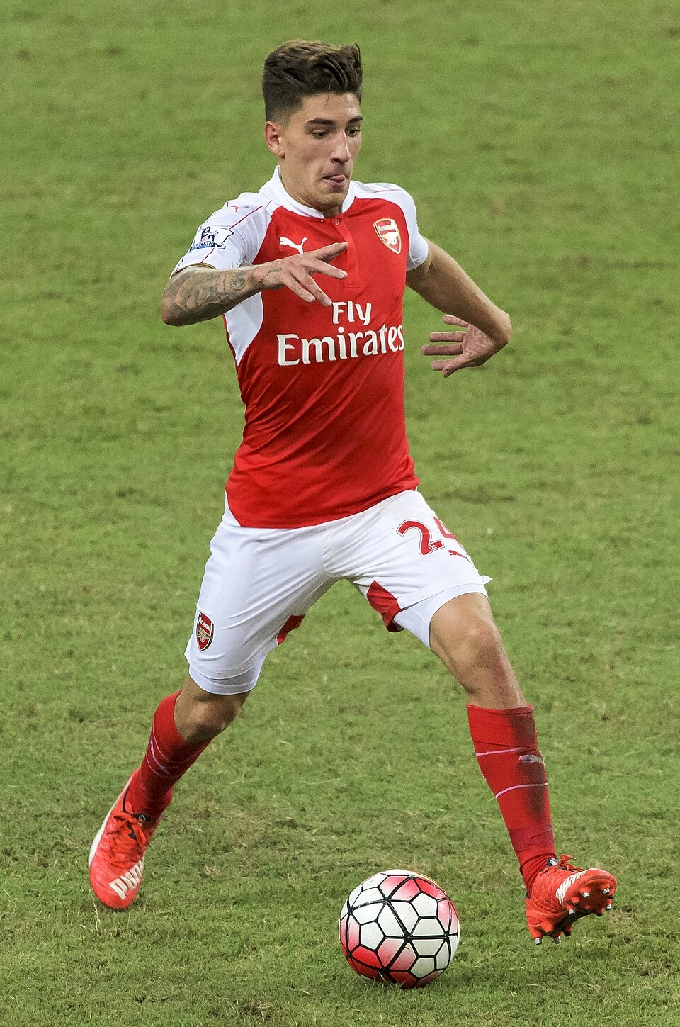 Héctor Bellerín in an Arsenal match action photo