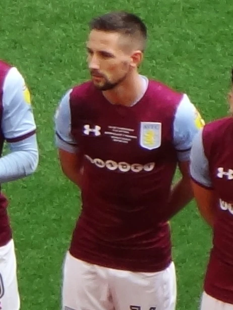 Conor Hourihane in an Aston Villa kit on the pitch