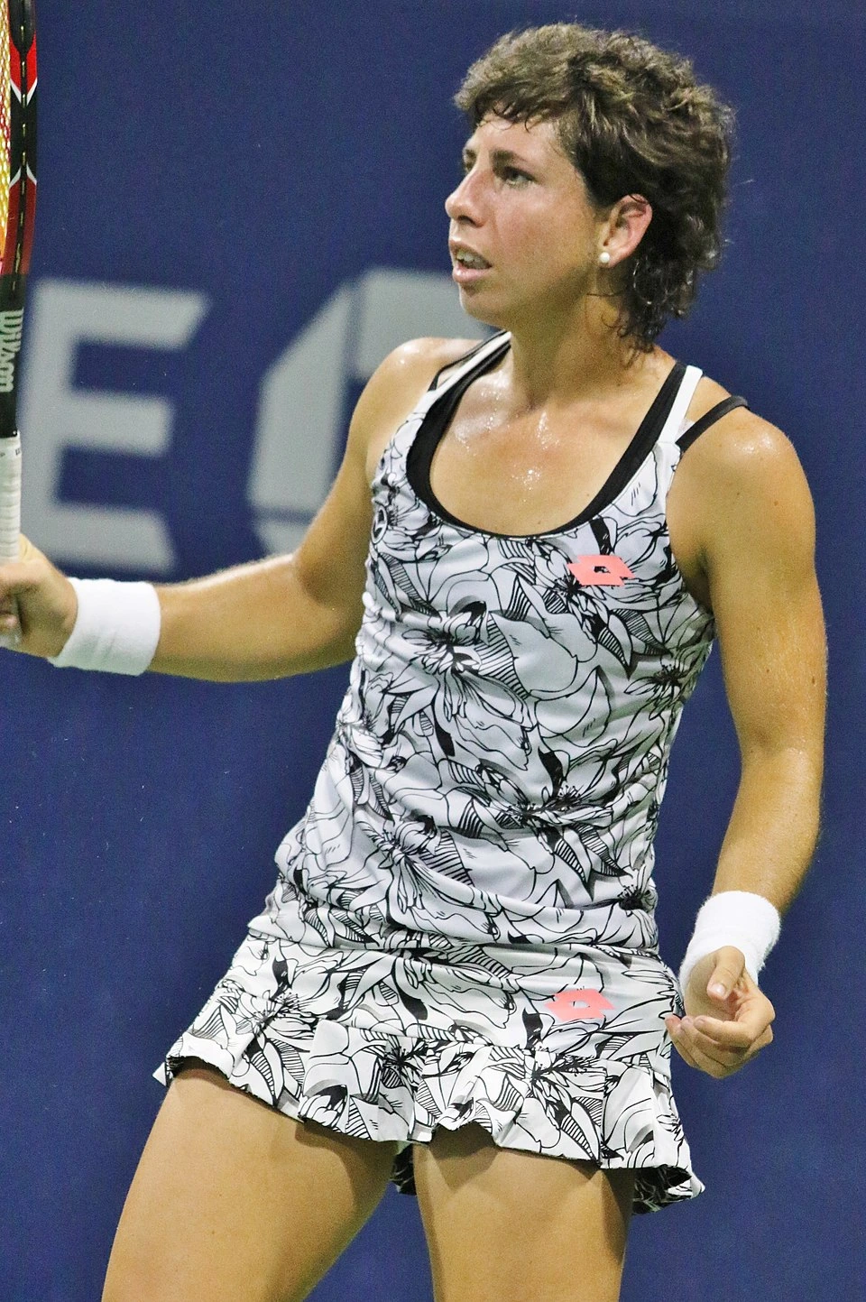Carla Suárez Navarro playing tennis in match action