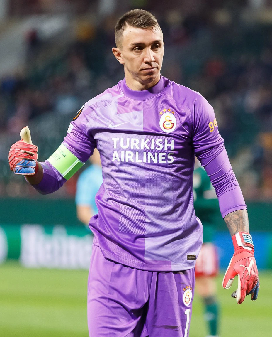 Fernando Muslera in a Galatasaray goalkeeper kit during a match