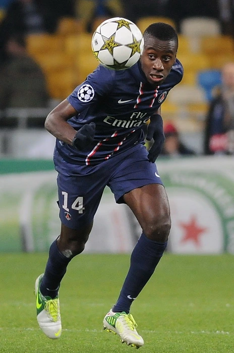 Blaise Matuidi in a PSG match, controlling the ball while wearing the number 14 jersey.
