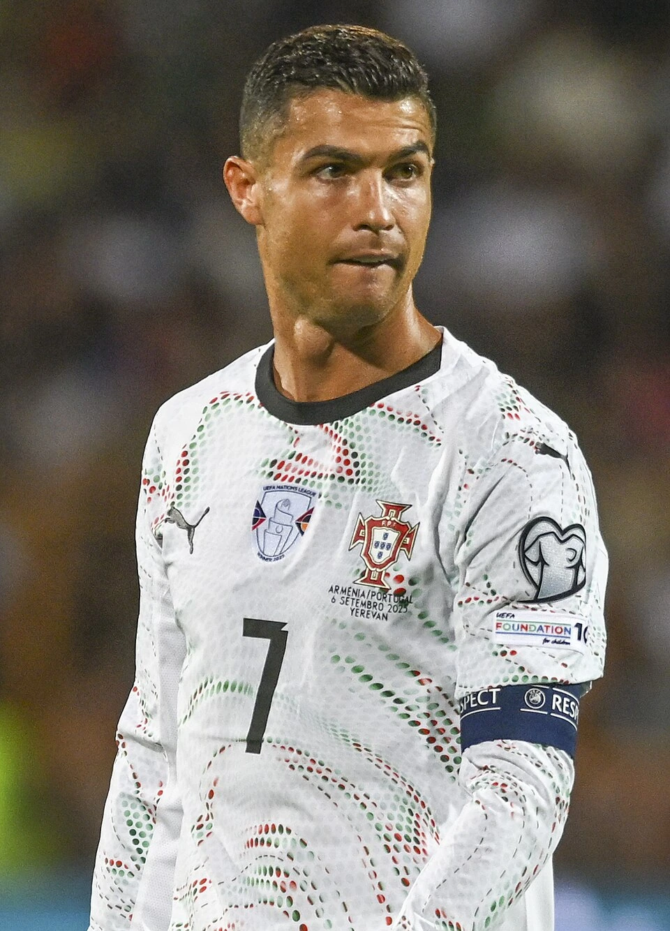 Cristiano Ronaldo in Portugal kit during a match, close-up portrait on the field