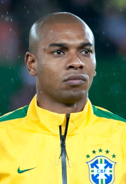Fernando Luiz Rosa (Fernandinho) in a Brazil national team jacket during a match or ceremony.