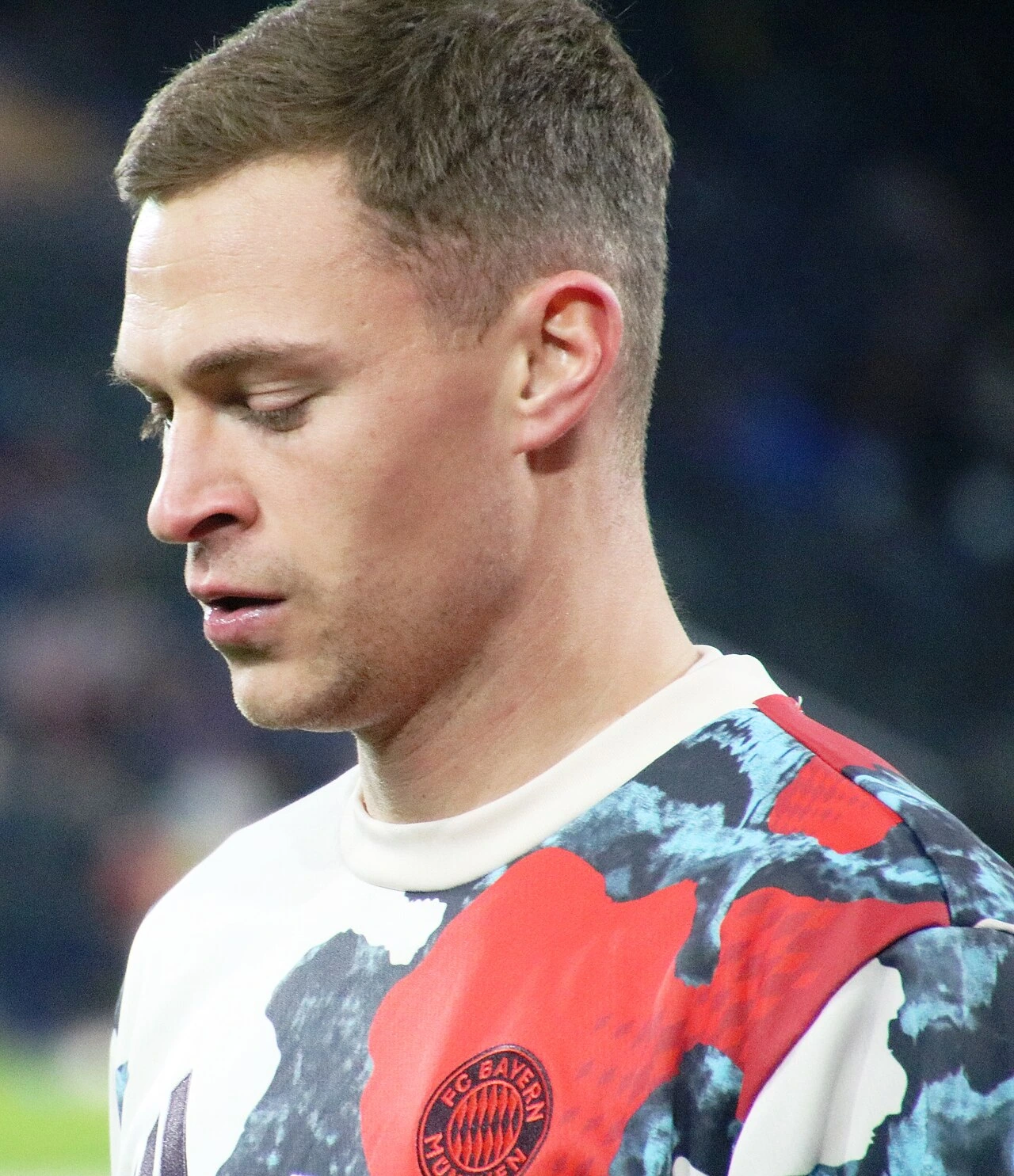 Joshua Kimmich in a close-up football photo, wearing a Bayern Munich training top