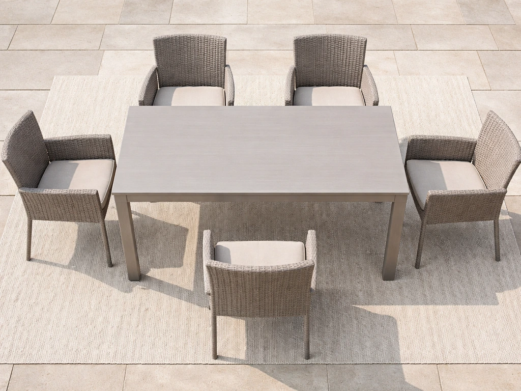Top-down view of patio dining table with spaced chairs showing room for people around the tabletop.